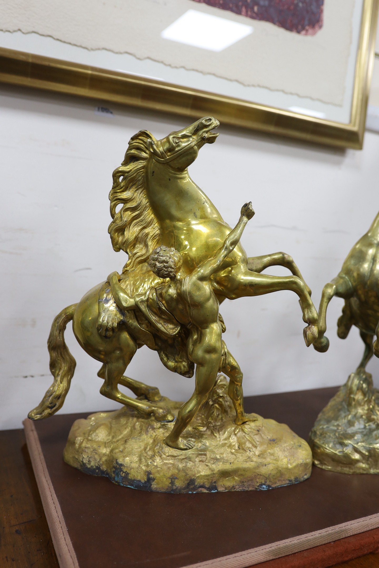 A pair of bronze Marly horses after Cousteau, 40cm high